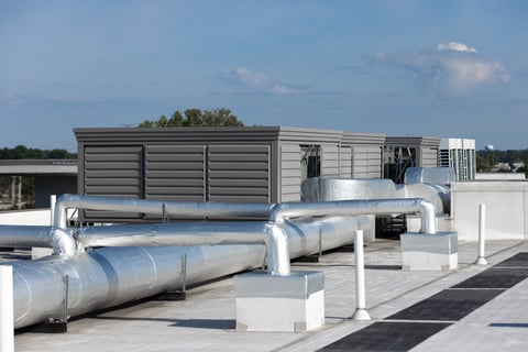 Rooftop Equipment Screening that Accommodates Duct Work